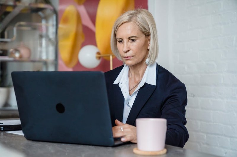 business owner using laptop - ai agents what is it